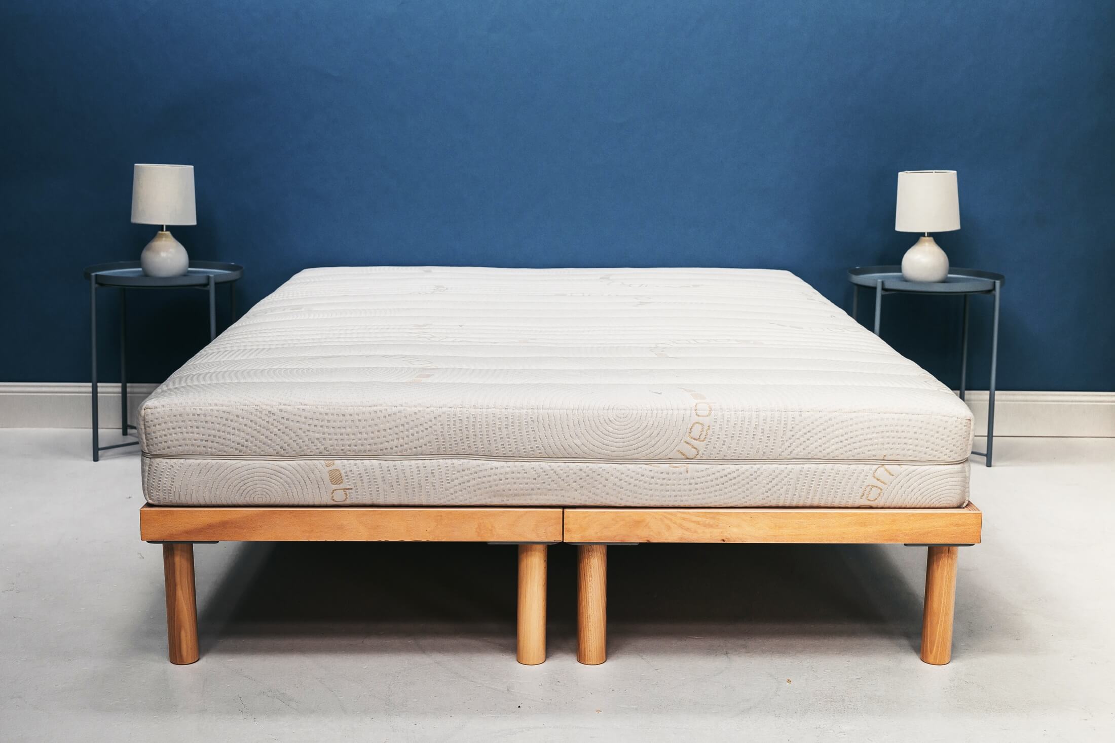 Zenna latex mattress on natural timber bed frame, front view showing bamboo zip-off cover